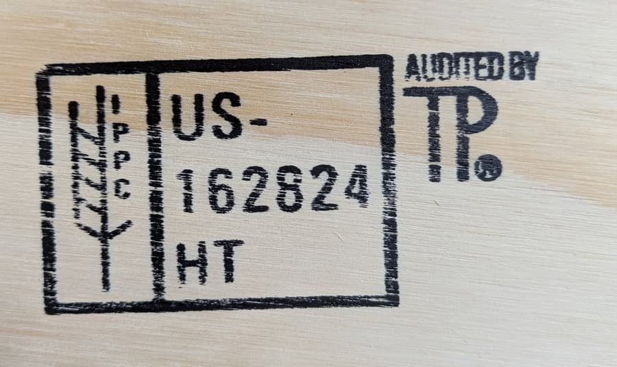 IPPC mark and HT treatment code stamped on wood.