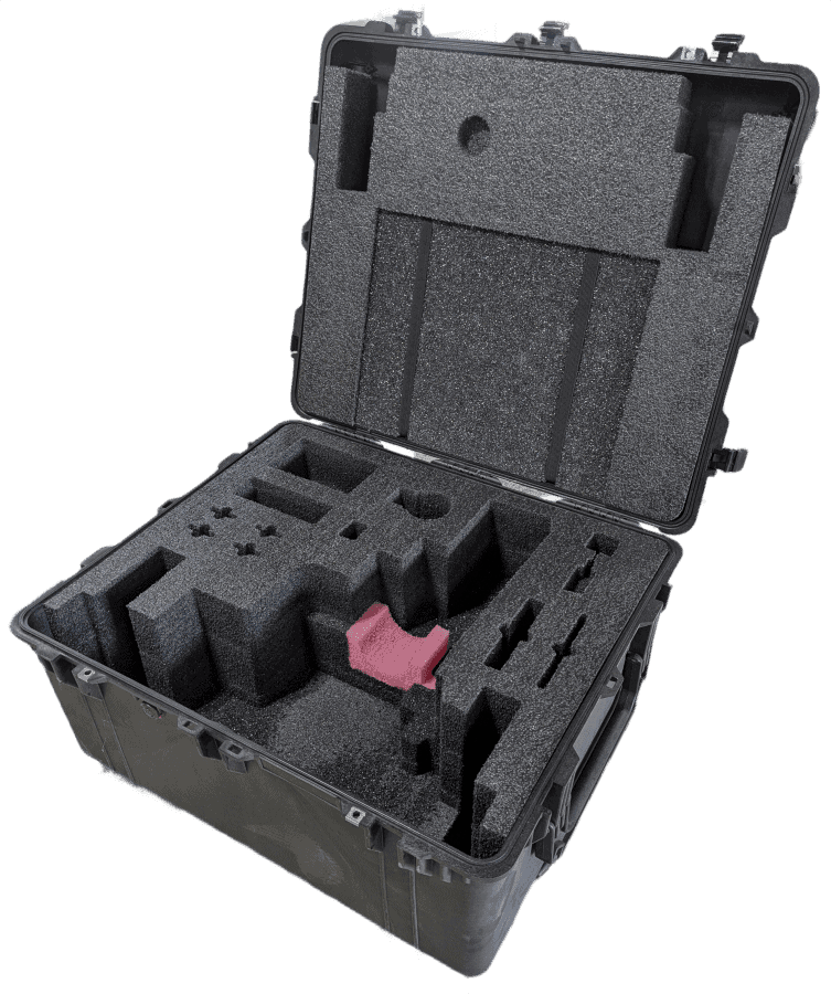 Angled open hard case with stepped foam compartments and a pink insert.