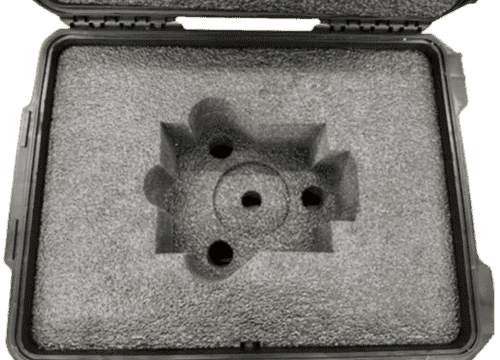 Custom foam base with circular and shaped pockets for a nuclear-defense component