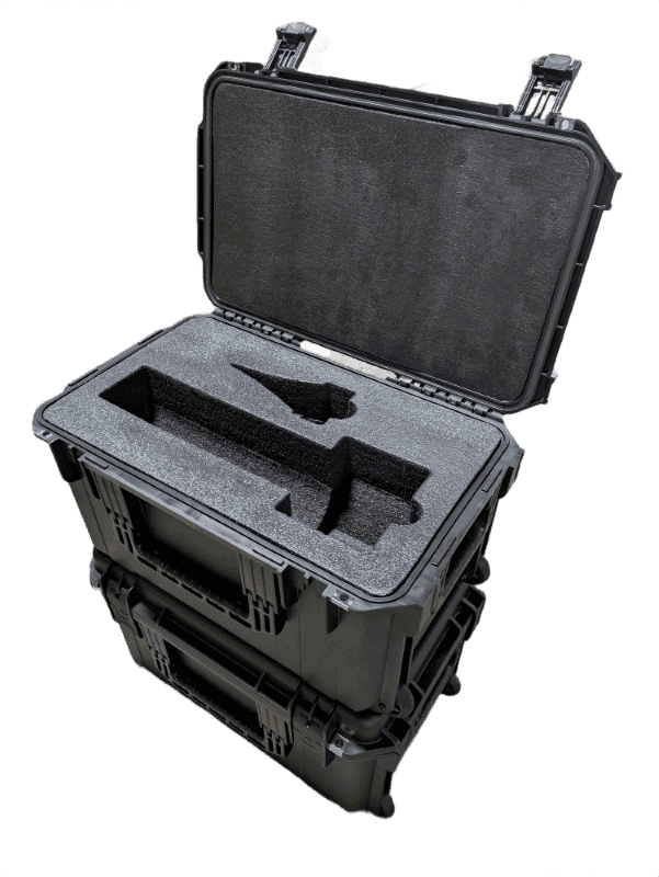 Open hard case with shaped foam pockets resting on a closed case