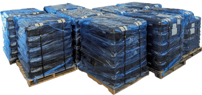 Completed cases from the military drone project wrapped and stacked on pallets