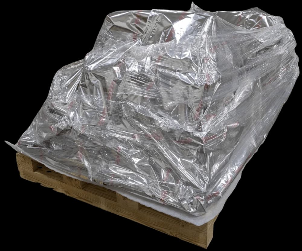 Several wrapped items secured together on a wooden pallet.