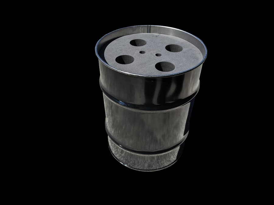Cylindrical dark foam assembly with circular openings in its top.