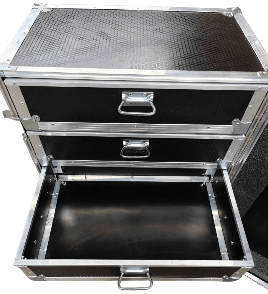 Detail of a black drawer case with its bottom drawer extended.