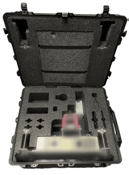 Initial prototype case and foam with visible damage and blurred equipment inside