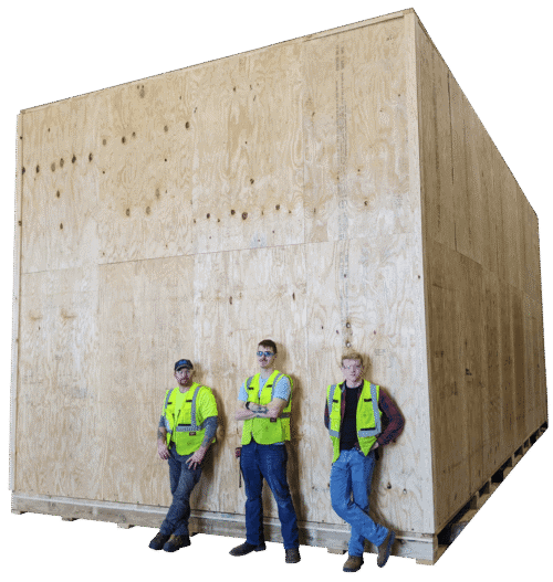 Team picture in front of an oversized wood crate